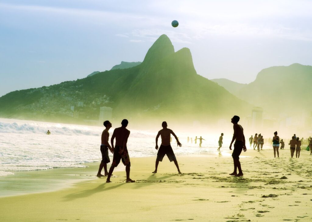 Rio locals playing football on beach